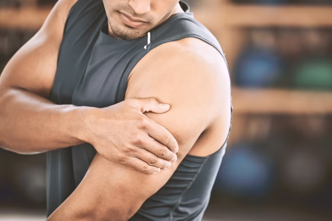 fit man experiencing arm cramp bodybuilder with s 2026 03 25 06 34 47 utc