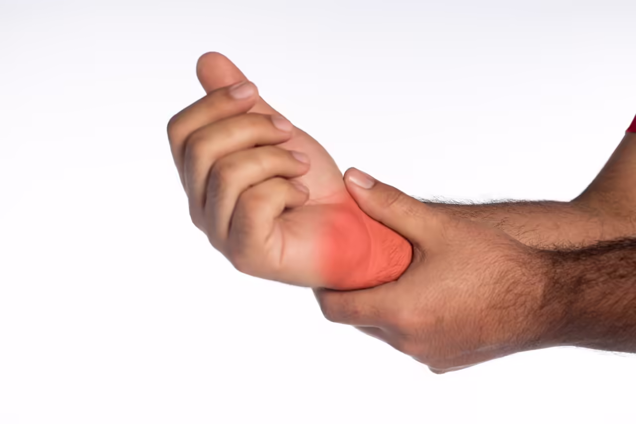 hand holding wrist highlighted in red on white 2026 03 26 11 42 53 utc