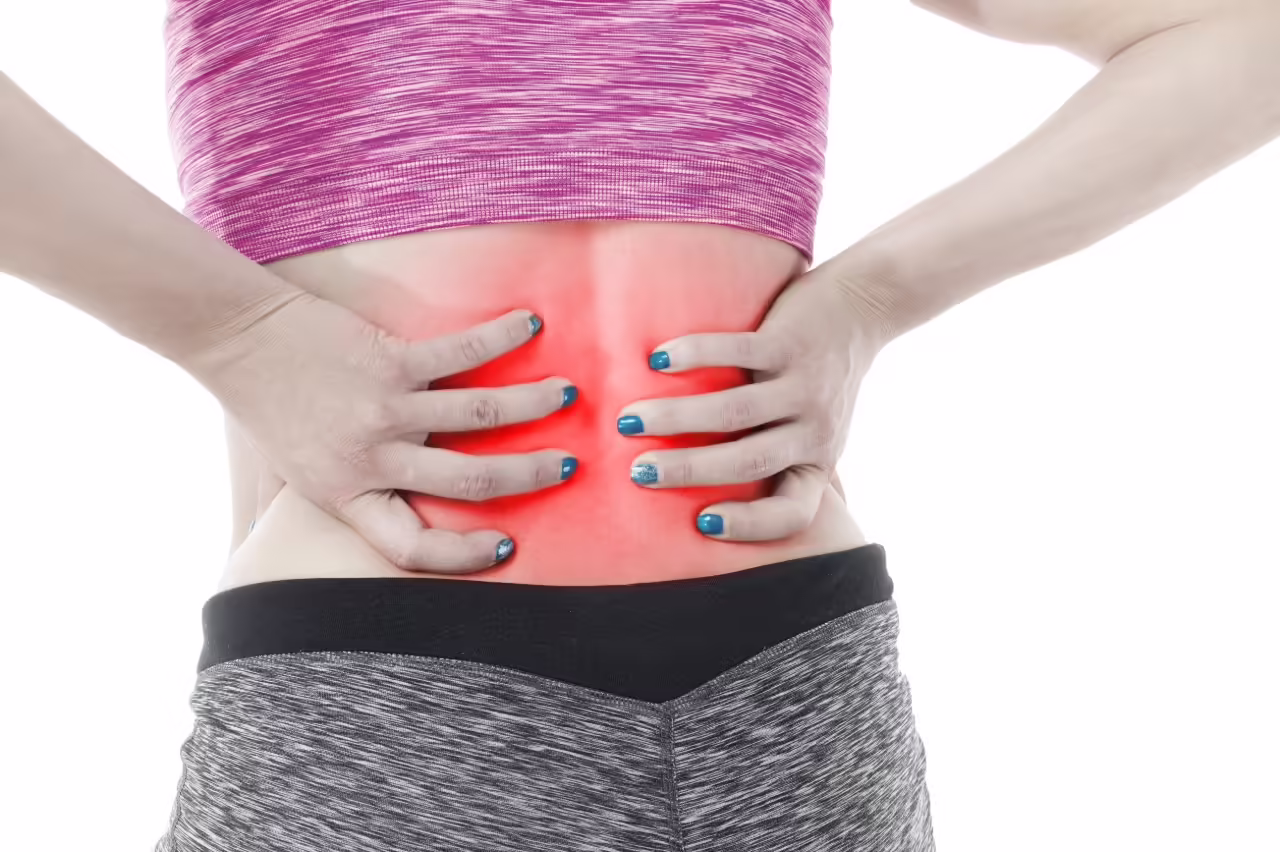 woman with back pain holding lower back 2026 03 26 05 35 15 utc